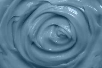 Cream texture. Cosmetic cream background. Color of the year 2020 classic blue toned.