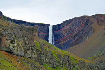 Impressive and breathtaking view onto Iceland´s fourth tallest or highest waterfall cascade Hengifoss with beautiful natural landscape and scenery and visible Paleosol © Tamme Wichmann