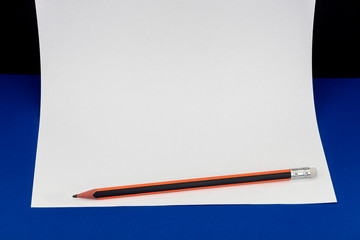 Blank Paper For Text and Wooden Pencil on Blue Background