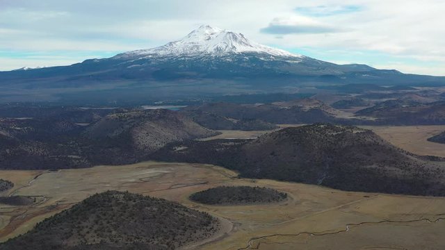 Mount Shasta in northern California is among the largest and most active volcanoes in the Cascade Range. The peak reaches 14,160 feet and the summit is covered with snow throughout the year.