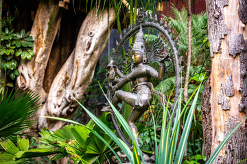 Metal statue if hindu goddess kali in the garden