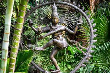 Metal statue if hindu goddess kali in the garden