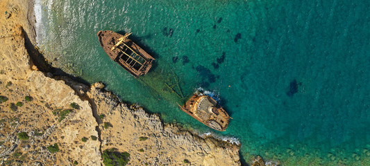 Aerial drone ultra wide photo of iconic rusty shipwreck in Amorgos island, Cyclades, Greece