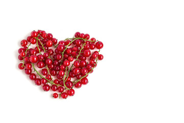 Juicy fresh berries of red currant heart shaped isolated on a white background. Flat lay, Copy space for text. Valentine's day concept