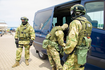 Special-purpose team arrived at the exercises. They unload weapons and special equipment from a...