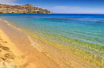 Summertime. Mykonos: Paradise beach (Kalamopodi),Greece. Sunny with blue sky and crystal clear water. Paradise is definitely the most famous beach of Mykonos: thin sand and emerald green water.