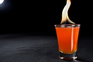 red fruit alcoholic drink with fire