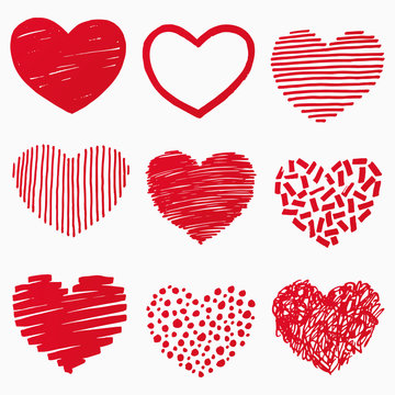 Red hearts in hand drawn style. Grunge heart shape set isolated on white background. Symbol of love. Doodle element for Valentines Day or wedding design. Vector illustration