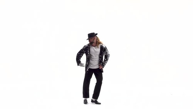Young stylish teenager is showing dance moves. Isolated over white background.