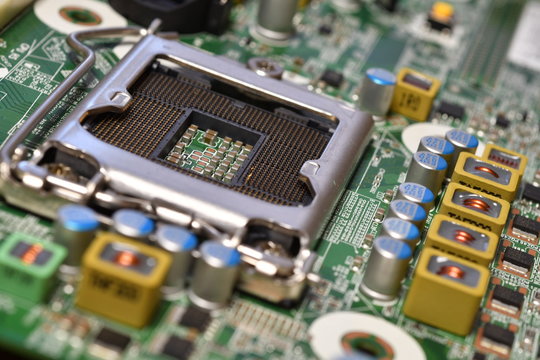Detail of cpu socket on a modern computer motherboard. Electronic small component details.