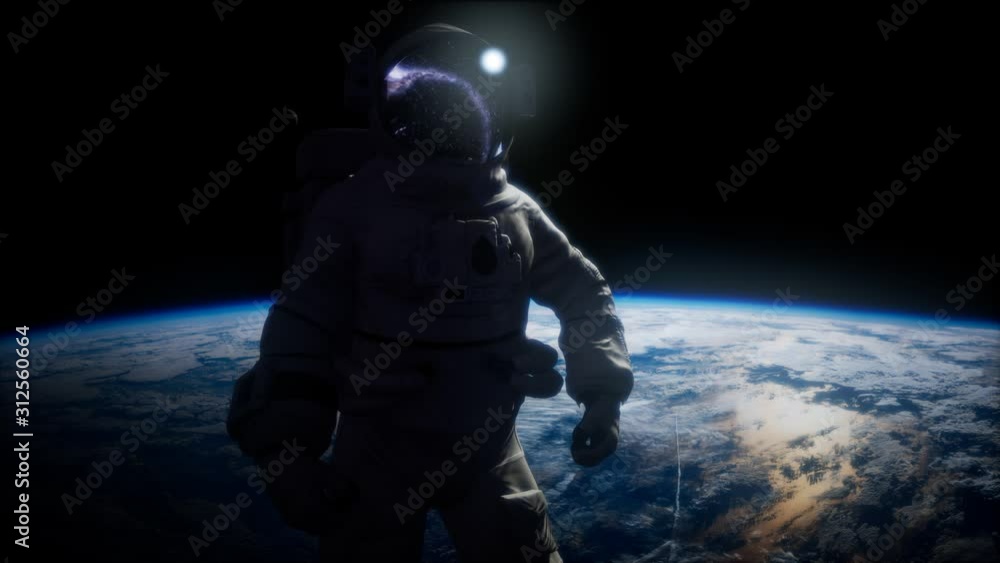 Wall mural astronaut in outer space against the backdrop of the planet earth. elements of this image furnished 