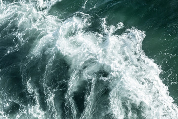 Obraz na płótnie Canvas Blue deep sea foaming water background 