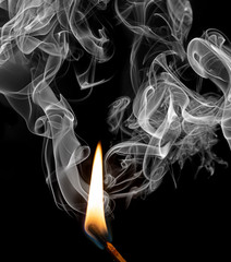 a match with fire and smoke