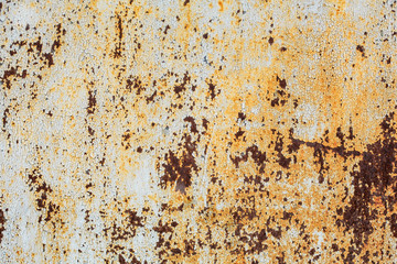 texture of an old rusty sheet of metal painted with white paint burnt out in the sun