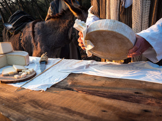 Cheese at market stall in a rural area.