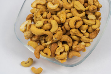 Cashews in a clear glass bowl. 