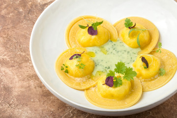 Ravioli on a plate, restaurant serving, close up.