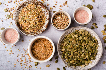 Various cereals and grains in bowls, healthy diet