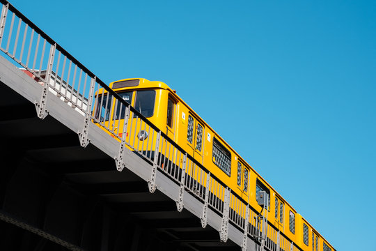 The Berlin U-Bahn train (metro train) U1 on elevated railroad bridge outdoor Berlin, Germany - June, 2019