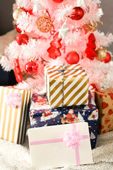 White Christmas tree, with red decoration and christmas light