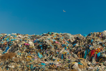 dump garbage hill ecology disaster nowadays problem concept pattern, blue sky background horizon with empty copy space for your text here