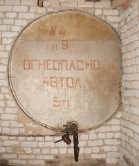 texture of a brick wall with bricked up fuel pipes