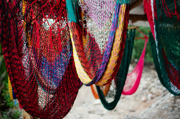 Knitted hammocks on display
