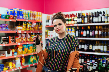 1980s Retro-Styled Woman Posing in Colorful Kiosk