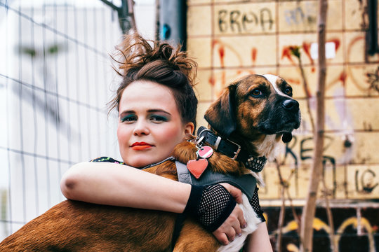 Portrait of Caucasian Woman Hugging Her Dog