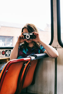 Anonymous Woman Taking Photo With Vintage Camera