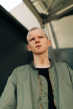 Portrait of young man with tattoo on his face