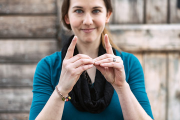 ASL: Woman Makes Sign For ""Meeting""
