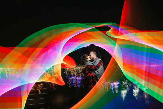 couple embracing within light