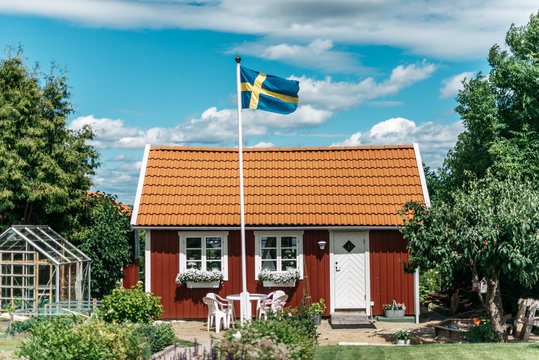 Flag waving in cosy courtyard in Sweden