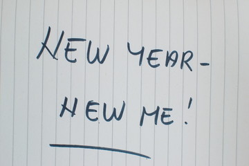 new year new me written in a notebook
