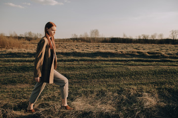 Young woman walking in field