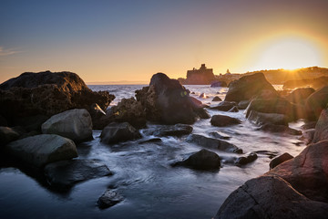 Sunset over Aci Castello