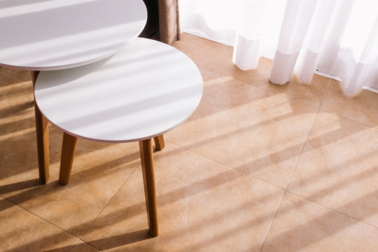 Tables in natural sunlight from a window