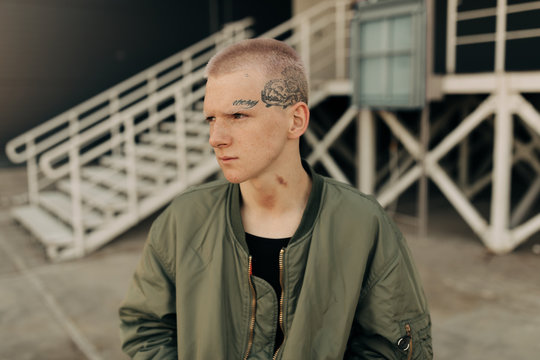 Portrait Of Young Man With Tattoo On His Face