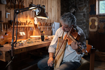 Man making a violin
