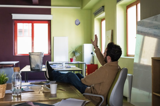 Young businessman playing in a modern office