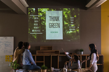 Young businesspeople working together on a green project