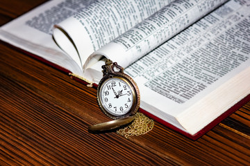 pocket watch with book background