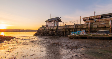 Sunrise at Kittery Point Harbor, Maine. Harbor master shack, wharf, dock, lobster cages.