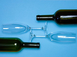 Empty Wine Bottle glasses blue background