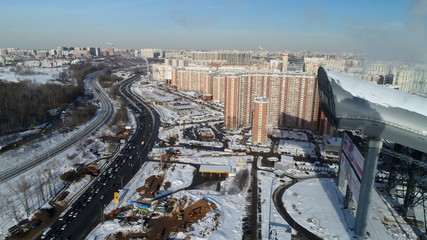 Pavshinskaya poyma district of Krasnogorsk, Moscow region, Russia. Mitino District is administrative district  of Moscow. Commuter town with very dense houses. View above.  Winter snow day