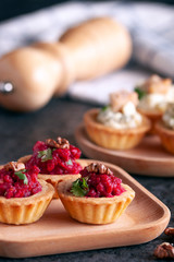 Tartlets with beetroot filling and nuts.