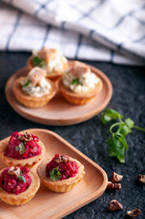 Tartlets with beetroot filling and nuts.
