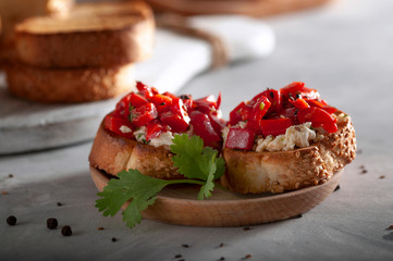 Fast and tasty Italian appetizer. Crispy, toasted bread with cheese, sweet pepper, garlic and herbs.