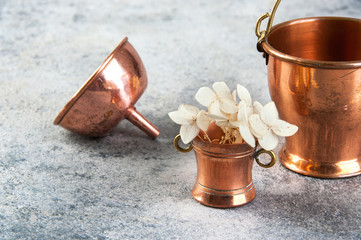 Set of 3 copper miniatures on concrete background